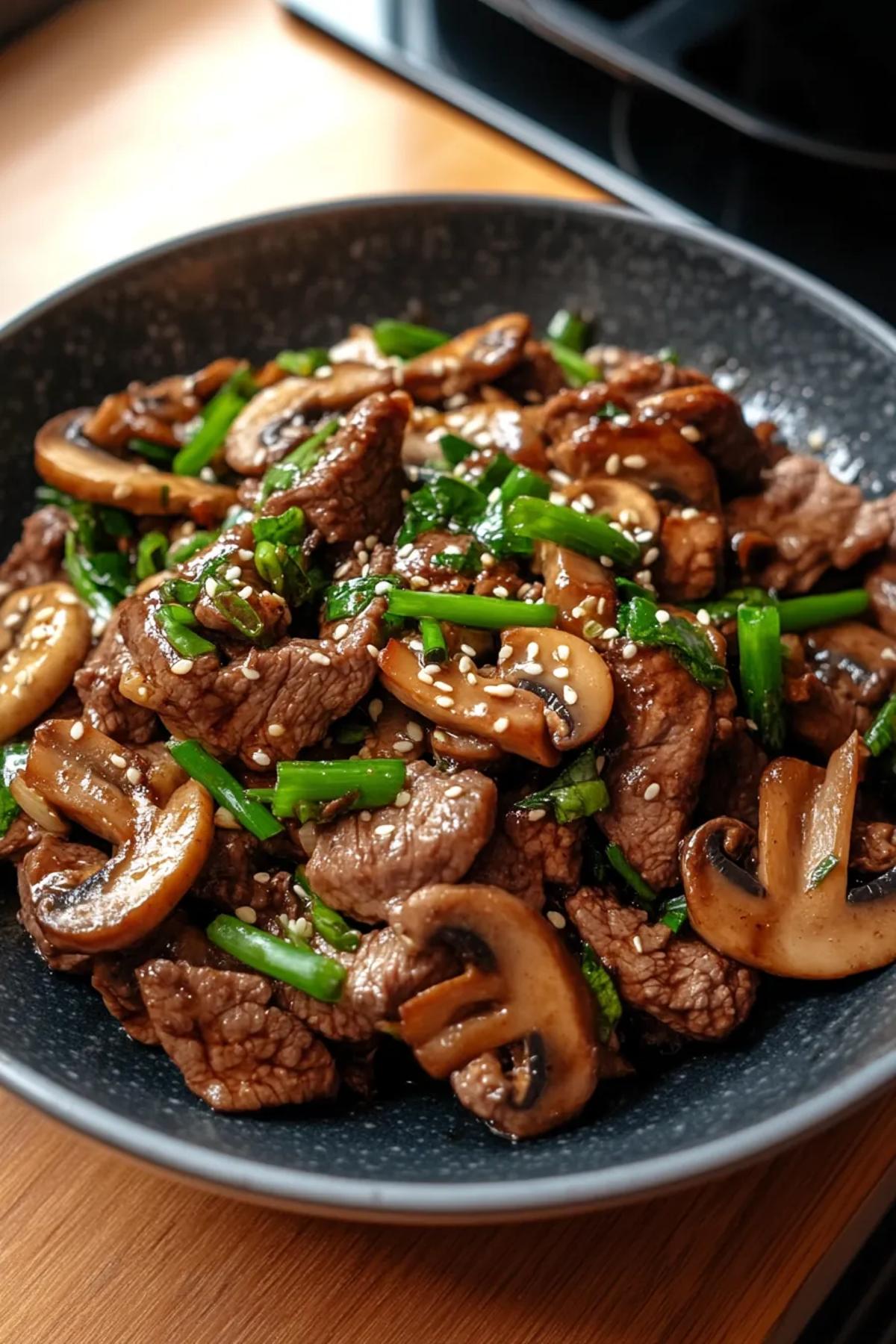 Tender beef strips and mushrooms in a savory sauce, served over a bed of steamed rice. card